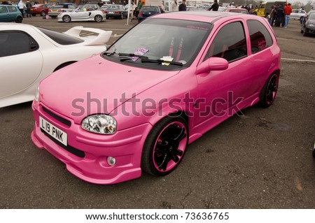 stock photo DERBY ENGLAND APRIL 12 Pink Vauxhall Corsa B on April
