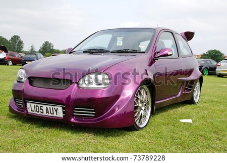 stock photo PETERBOROUGH ENGLAND MAY 24 Purple Vauxhall Corsa B on May