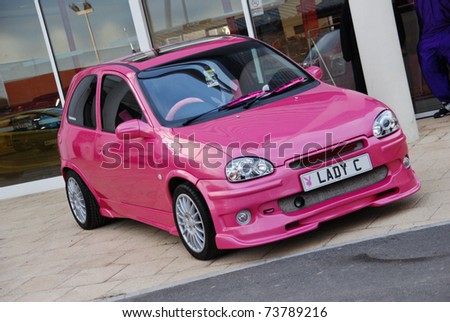 stock photo PETERBOROUGH ENGLAND MAY 24 Pink Vauxhall Corsa B on May