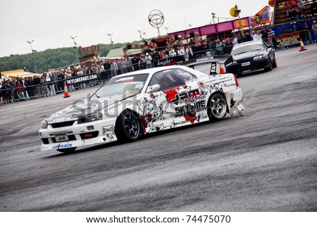 stock photo NORTHANTS ENGLAND AUG 2 White Nissan Drift Car with Decals