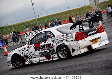 NORTHANTS, ENGLAND - AUG 2: White Nissan Drift Car with Decals on display at the Annual Ultimate Street Car Show on August 2, 2008 in Northants, England, UK. Santa Pod is host to the show