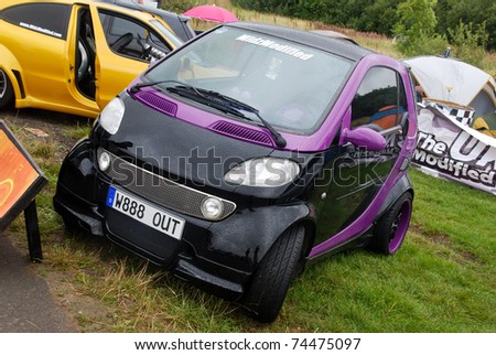 NORTHANTS, ENGLAND - AUG 2: Black and Purple Smart Car on display at the Annual Ultimate Street Car Show on August 2, 2008 in Northants, England, UK. Santa Pod is host to the show