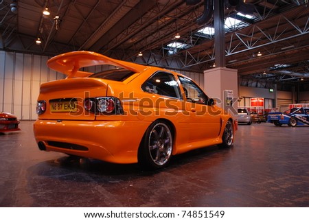 stock photo BIRMINGHAM ENGLAND JULY 5 Orange Ford Escort Cosworth on 