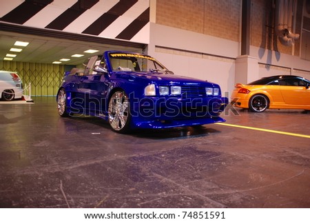 stock photo BIRMINGHAM ENGLAND JULY 5 Blue Ford Escort Cabriolet on 