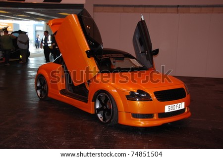 stock photo BIRMINGHAM ENGLAND JULY 5 Orange Audi TT on Display at