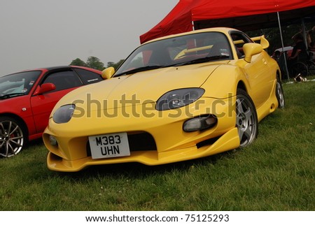 WAKEFIELD, ENGLAND - MAY 10: Yellow Toyota Supra on Display at the Annual Rising Sun Car Show on May 10, 2008 in Wakefield, England, UK.  Norton Priory is host to the show
