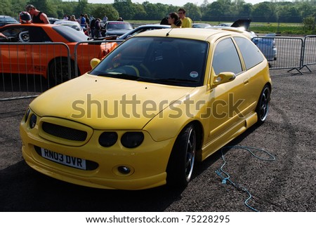 stock photo NORTHANTS ENGLAND MAY 11 Yellow MG ZR on Display at