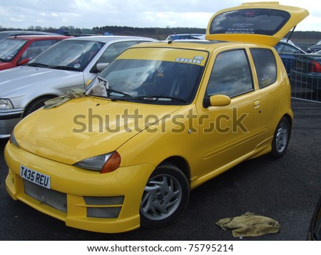 stock photo NORTHANTS ENGLAND MARCH 8 Yellow Fiat Seicento on Display 
