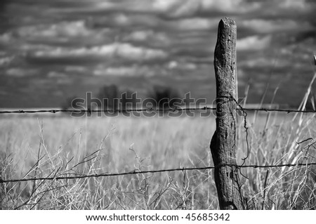 old wood fence post in a rural setting
