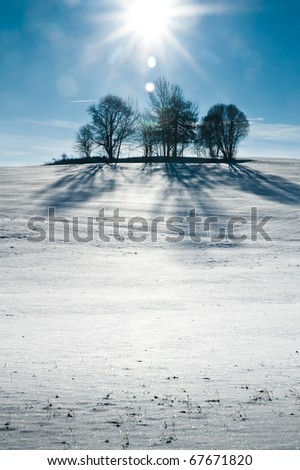 Snowy Hill with Sun