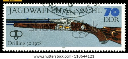 GERMANY - CIRCA 1978: post stamps printed in Germany,  shows  antique Three-Barreled Gun. 1978,  Hunting Guns series, circa 1978