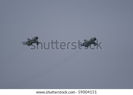 BUCHAREST, ROMANIA - JULY 17: Jet Fighters perform during the airshow on July 17, 2010 on Henri Coanda airport, Bucharest, Romania.