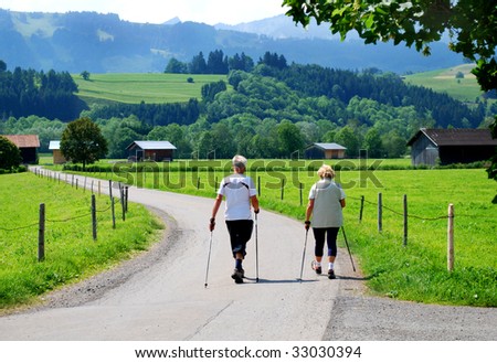 elderly people nordic walking in the bavarian alps germany