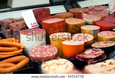a variety of german sausage products in cooling shelf