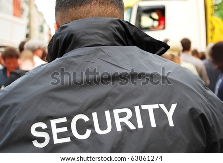 security guard in front of crowd