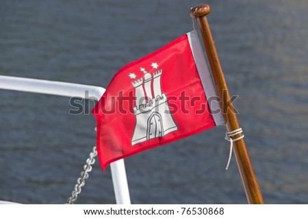 red hamburg flag on a sights-seeing ship on the alster