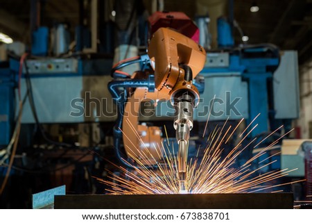 Industrial robot is welding test run program in car factory