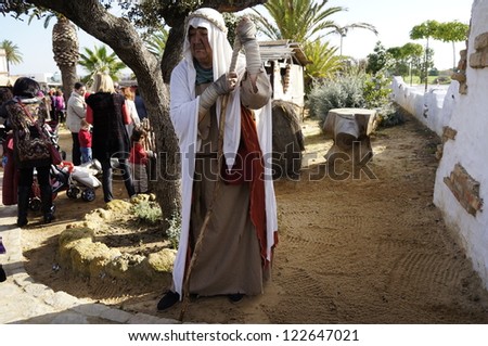 CORRALES, HUELVA, SPAIN - DECEMBER 23: The Living Crib of Corrales celebrations, an undefined woman at work acting at reenactment of the Living Nativity, on December 23, 2012 in Corrales, Spain