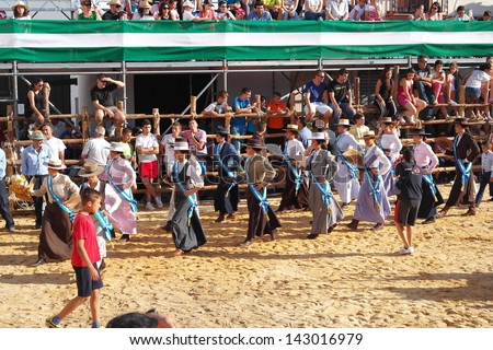 SAN JUAN, HUELVA, SPAIN - JUNE 20: The festival of St. John the Baptist\'s. Running of the Bulls of San Juan is the most popular celebration in Andalusia on June 20, 2013 in San Juan, Huelva, Spain