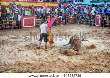 SAN JUAN, HUELVA, SPAIN - JUNE 22: Saint John's the Baptist's festival is the Spain's running of the Bulls of San Juan is the most popular celebration in Andalusia on June 22, 2013 in San Juan, Spain
