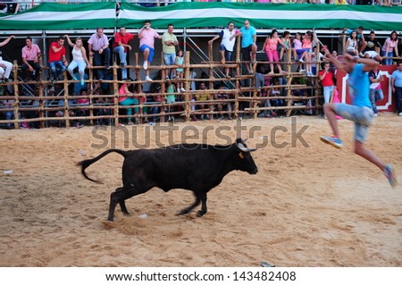 SAN JUAN, HUELVA, SPAIN - JUNE 23: The festival of St. John the Baptist's. Running of the Bulls of San Juan is the most popular celebration in Andalusia on June 23, 2013 in San Juan, Huelva, Spain