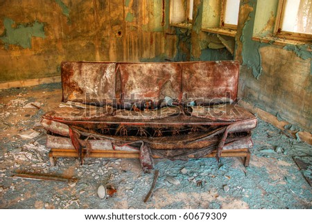 Abandoned old sofa in the factory