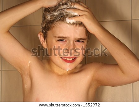 Cute boy washing hair