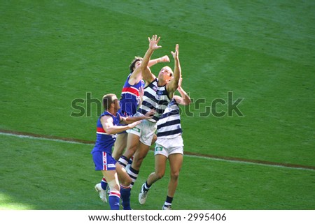 Editorial, Australian rules football player go for catch,