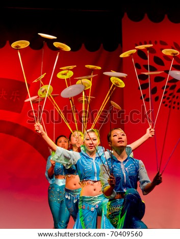HELSINKI, FINLAND - FEBRUARY 2: Chinese New Year 2011 celebration - Chinese acrobats with spinning plates performing live on stage at Lasipalatsi Square on February 2, 2011 in Helsinki, Finland.