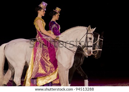 HELSINKI,FINLAND-FEBRUARY 4:Two riders act on Apassionata Together Forever -show  at Hartwall Areena on February 4,2012 in Helsinki, Finland. Show brings together humans and horses in magical harmony