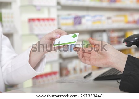 Customer hands over her payment customer card