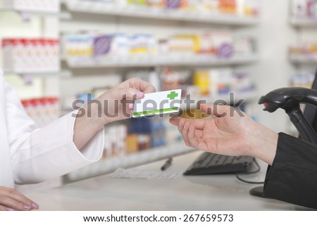 Customer hands over her payment customer card
