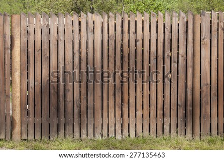 painted weathered wood planks make a nice garden fence