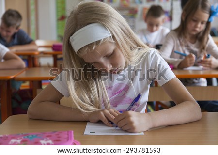 School children in primary school take a grammar test