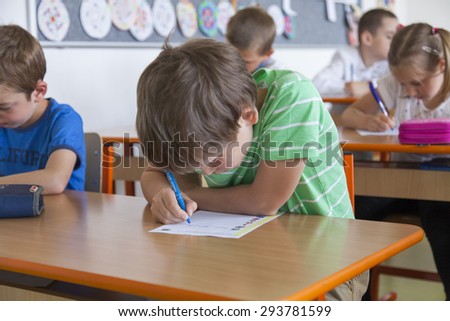 School children in primary school take a grammar test