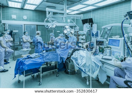 Neurosurgeons operate on a tumor on the brain of a patient in the operating room of Neurosurgery