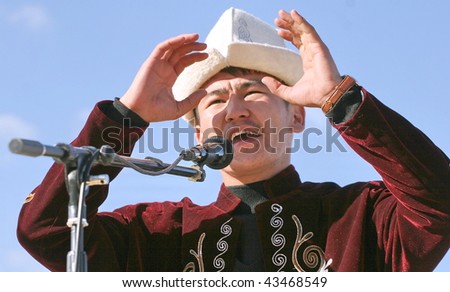 KYRGYZSTAN - JULY 21: Compere announces the prize winners at the Central Asian Horse Games on July 21, 2009 in Kyrgyzstan