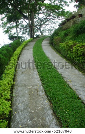 striped lawn driveway at a british era colonial bungalow in darjeeling india