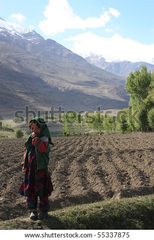 ISHKASHIM, AFGHANISTAN - MAY 29: Hasti, 7, surveys her family farm in the northern provinces on May 29, 2010 in Ishkashim, Afghanistan