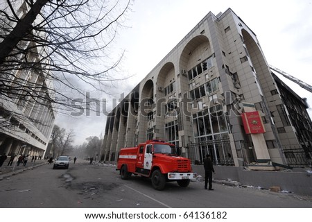 BISHKEK, KYRGYZSTAN - APRIL 7: Fire engine and crew attempt to put out fire set by protesters at the Ministry of Justice during Kyrgyzstan\'s revolution on April 7, 2010 in Bishkek, Kyrgyzstan.