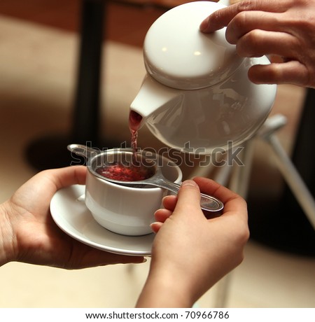 serving tea in a china teapot