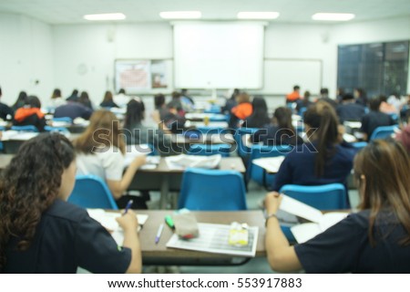 Abstract blur background of  student during study or quiz,  test and exams from teacher or in large lecture room / University classroom.