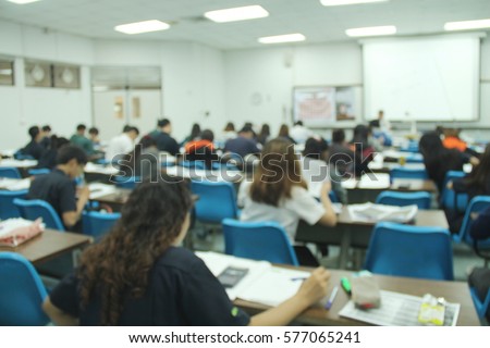 Abstract blur background of  student during study or quiz,  test and exams from teacher or in large lecture room / University classroom.