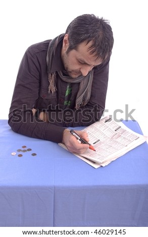 Man searching for a job in the newspaper  isolated on white background