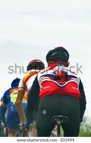 Backside view of three Cyclists in a row