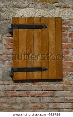 Square wooden shutter at a villa in Italy