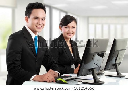 happy woman and man office worker working in the office