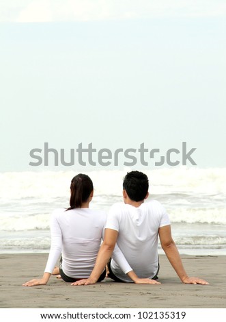 loving couple relaxing and spending quality time with each other on beach