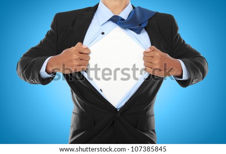 Businessman showing a superhero suit underneath his suit