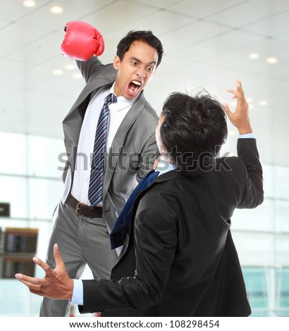 businessman hit his rival in the face at the office